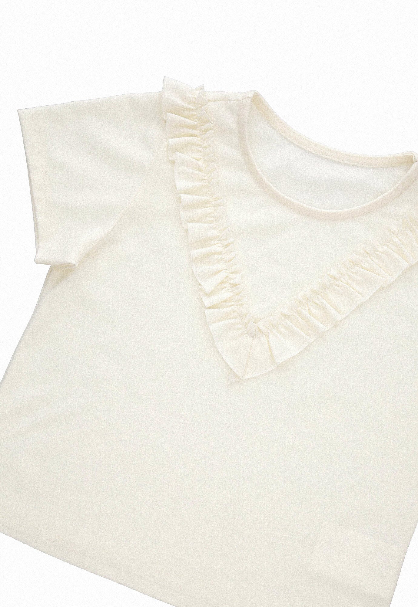 Camiseta ivory fondo entero, bolero sobrepuesto y manga corta para bebé niña